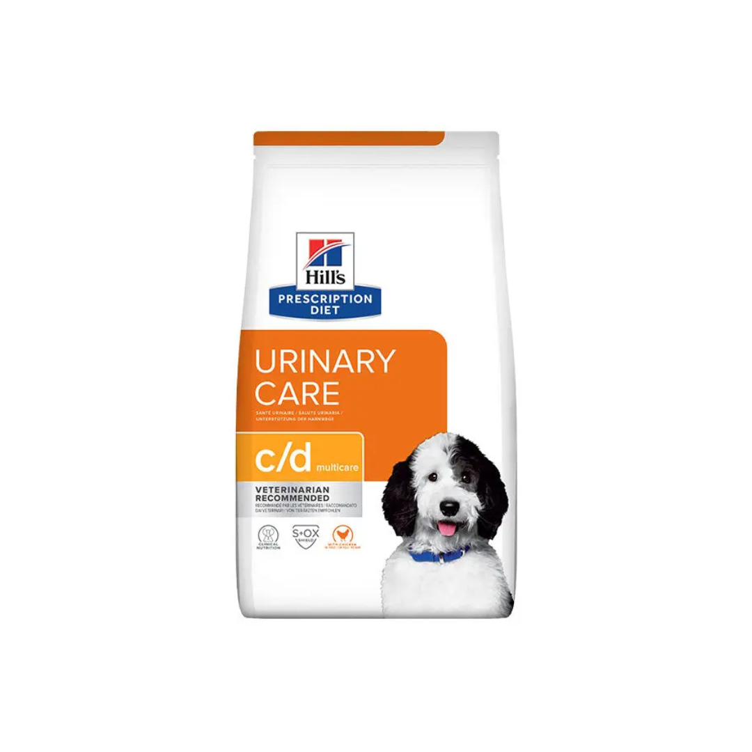 Bag of Hill's Prescription Diet c/d Multicare Urinary Care dry dog food, highlighting "URINARY CARE," "VETERINARIAN RECOMMENDED," and the S+OX Shield.
